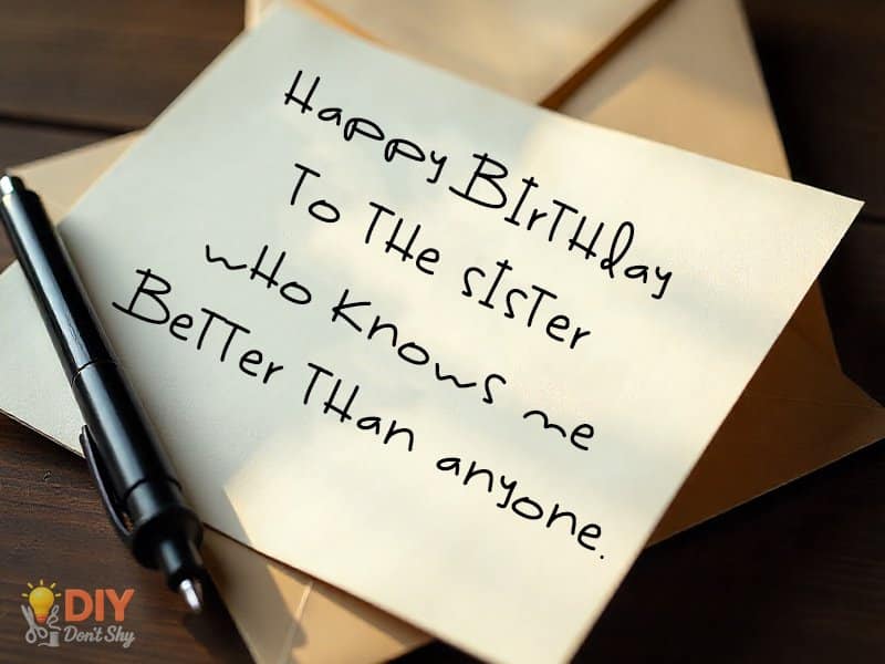 Close-up of short handwritten birthday messages inside a DIY card for a sister.
