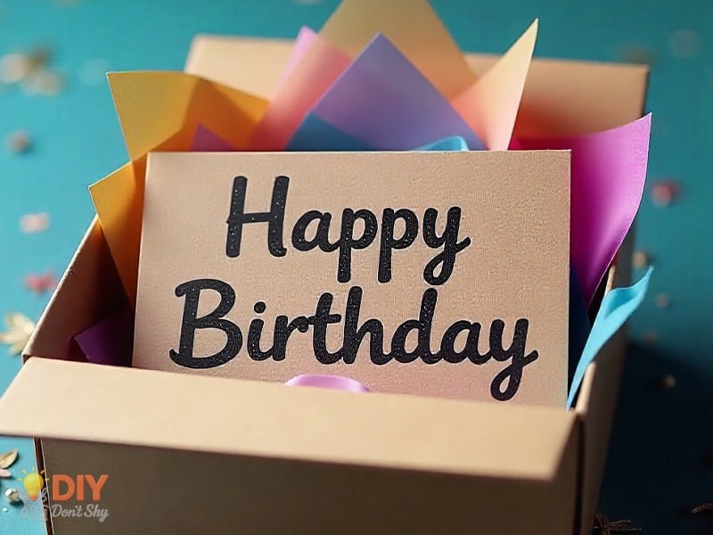 Easy homemade birthday card for guys made from folded recycled cardboard with bold lettering.