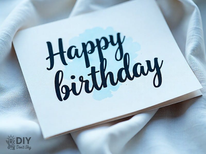 Hand-lettered Happy Birthday headline on watercolor card for Mom.