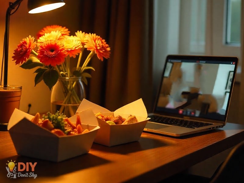 Virtual anniversary dinner setup with food and flowers in hotel room