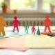 paper action figures and craft supplies on table for kids indoor activity