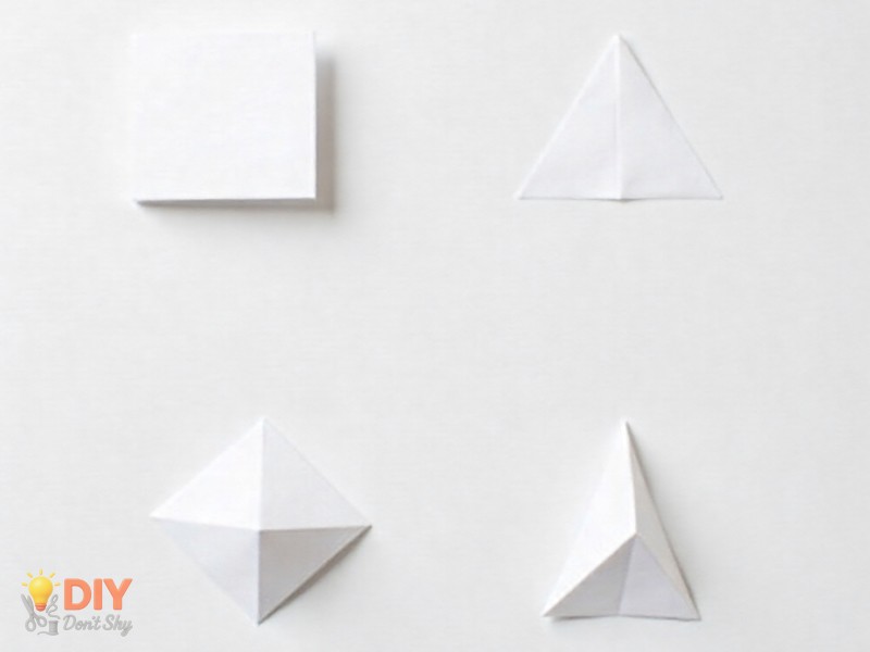 Step-by-step origami paper arrow folding tutorial showing triangle, diamond, and arrow shapes on white background.