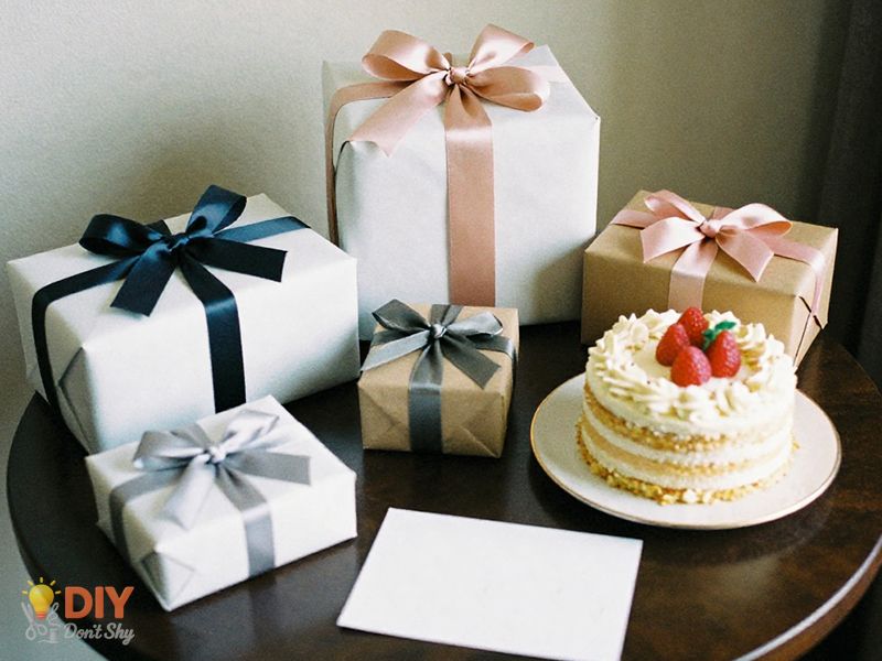 Neatly styled birthday setup image highlighting arrange gifts and table items in a hotel room.