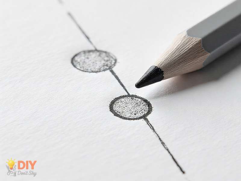 Light sketch of two curved lobes above a guideline for forming a Valentine heart.