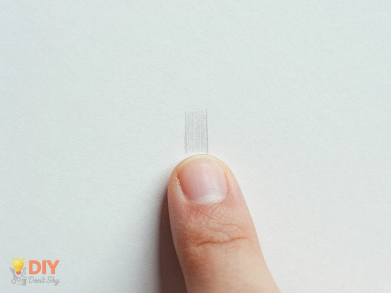 Step One Measuring Your Nail using paper and finger placement