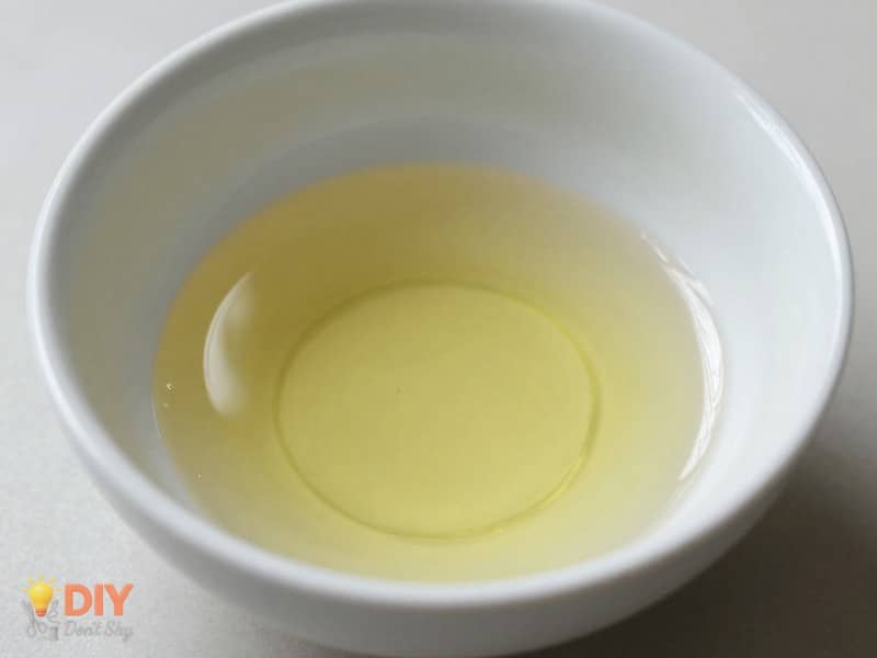 Close-up crafting image highlighting preparing the object to make a mold with household items.