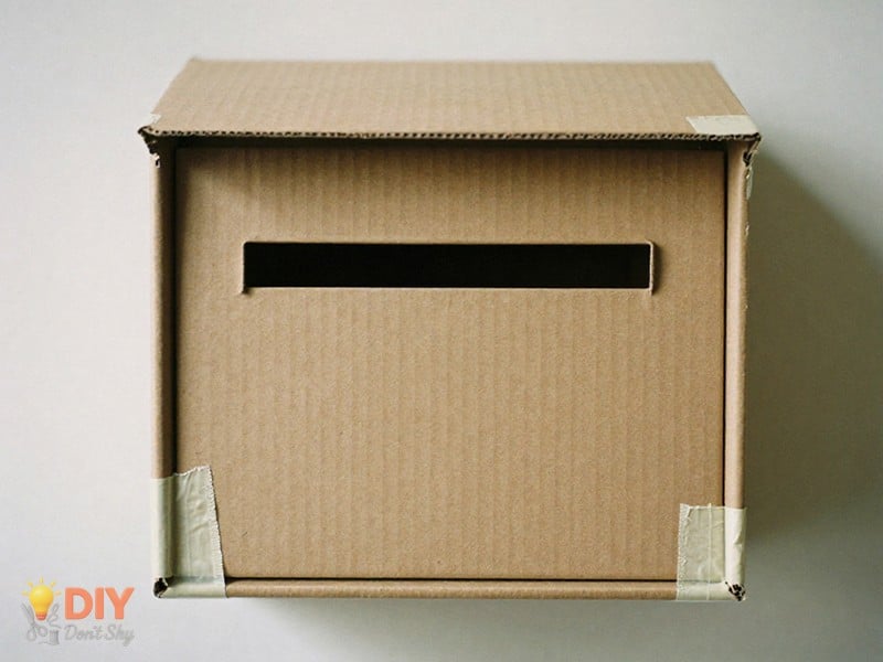 Creating An Easy Slide In Message Slot on a cardboard Valentine mailbox