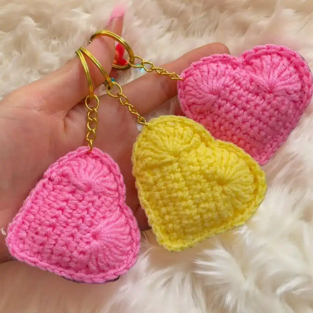 Different creative uses of crochet hearts including keychains, garlands, and gift decorations