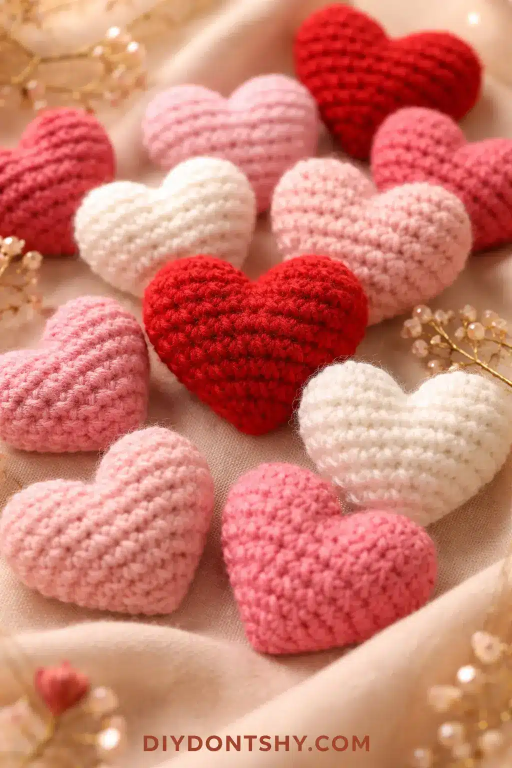 Close-up of handmade crochet hearts in red and pink yarn representing love and DIY Valentine's craft